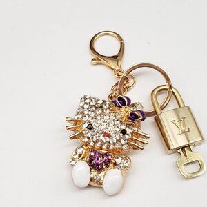 Authentic Louis Vuitton Lock & Key with unbranded Hello Kitty Bagcharm, Keycharm